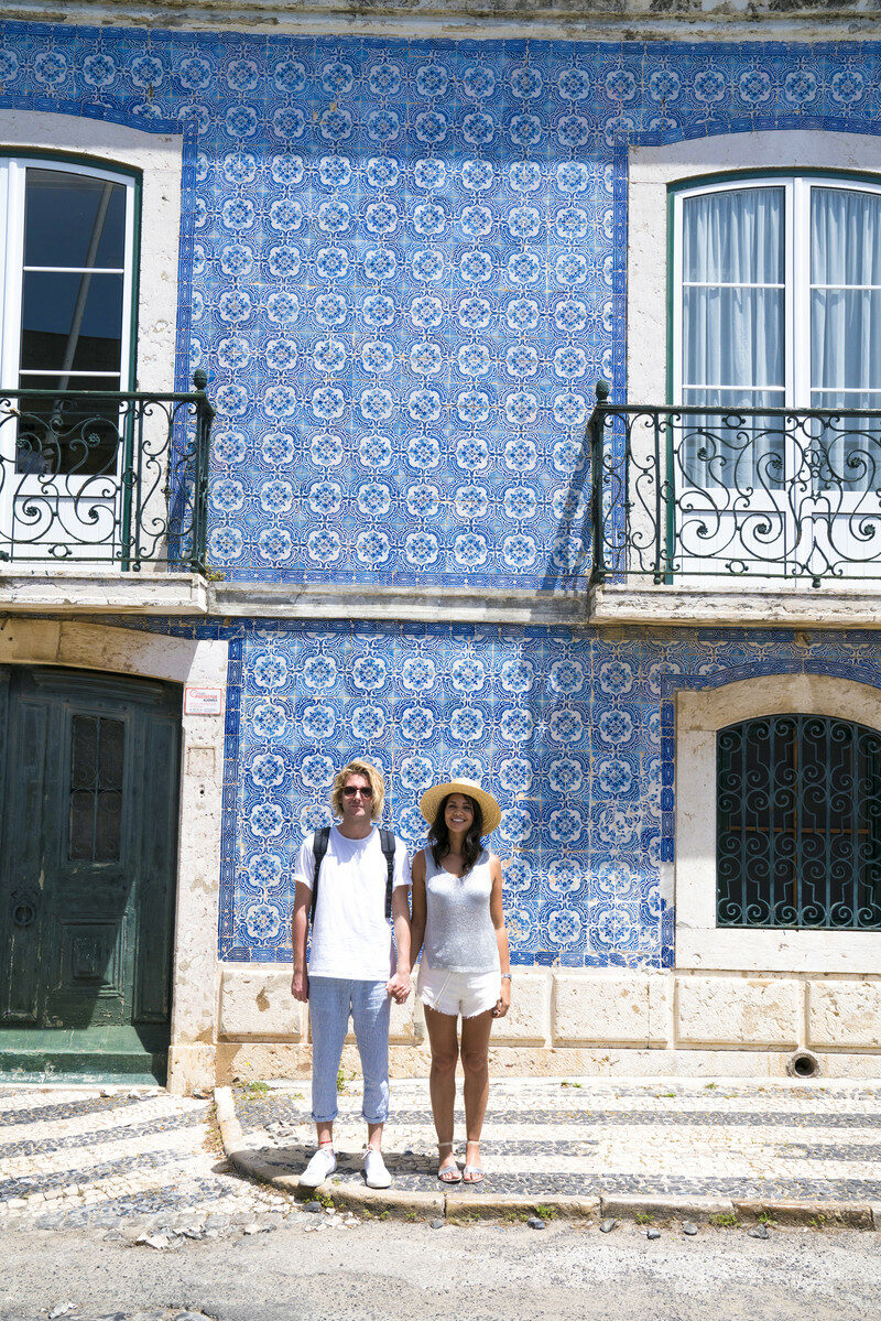 Lisbon tiles and couple on a trip to Portugal