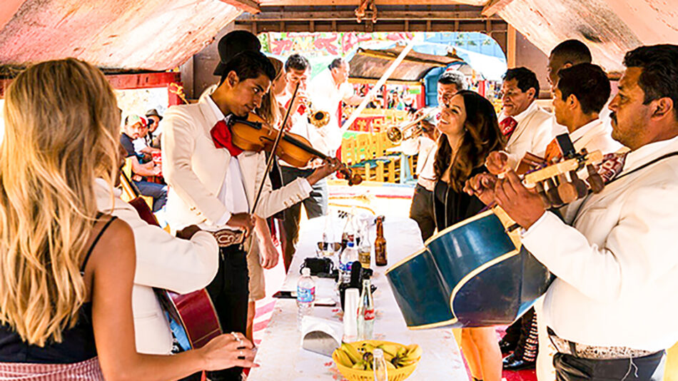 A group of people playing music in a tent.