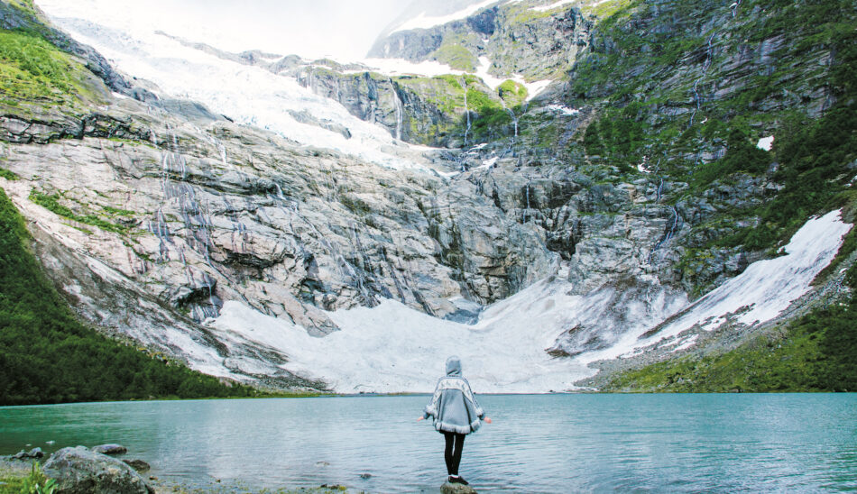 Norway mountain fjord woman standing by lake