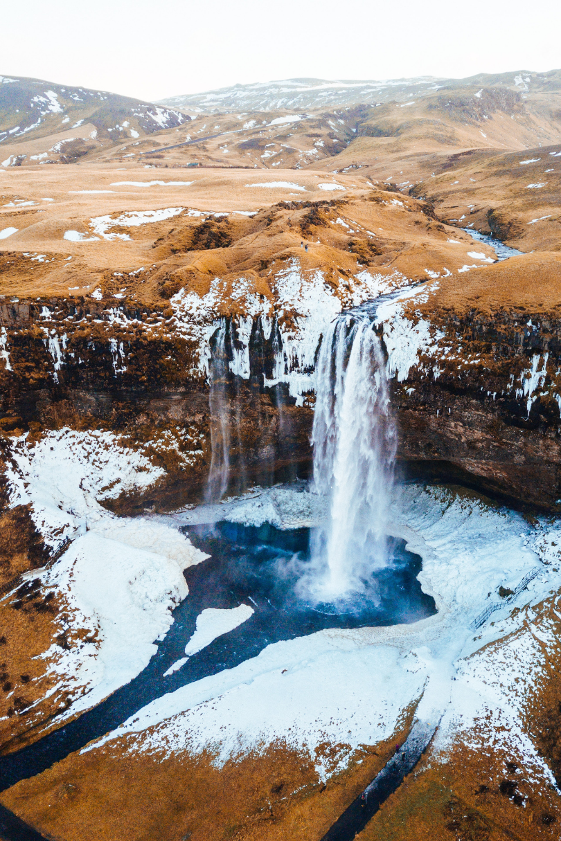 An aerial view of a waterfall in iceland.