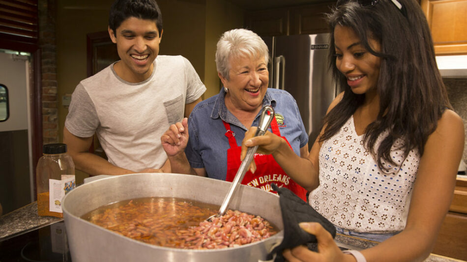 A group of people preparing food in a kitchen, one of the many things to do in North America.