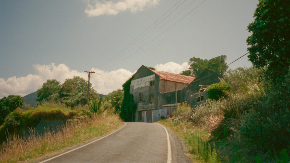 A road with a house on it.