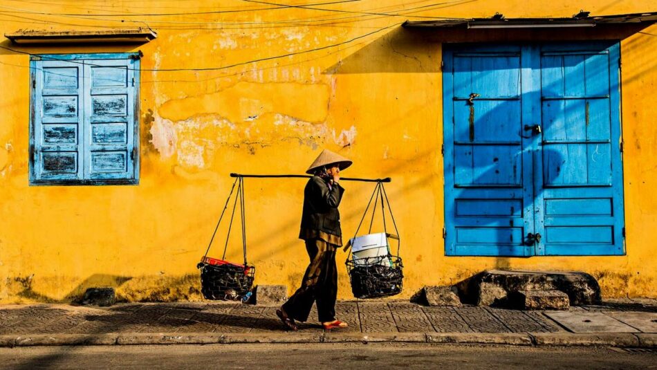 woman carrying basket in vietnam