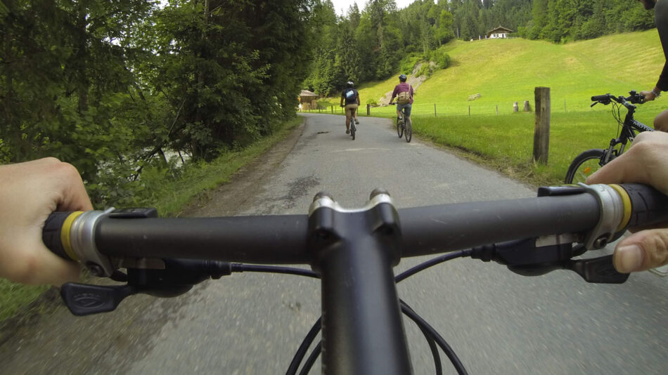 Adventures in Europe - image of handle bars following two cyclists