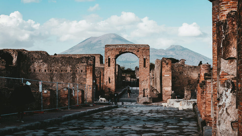 Pompeii ruins with mountains in the distance