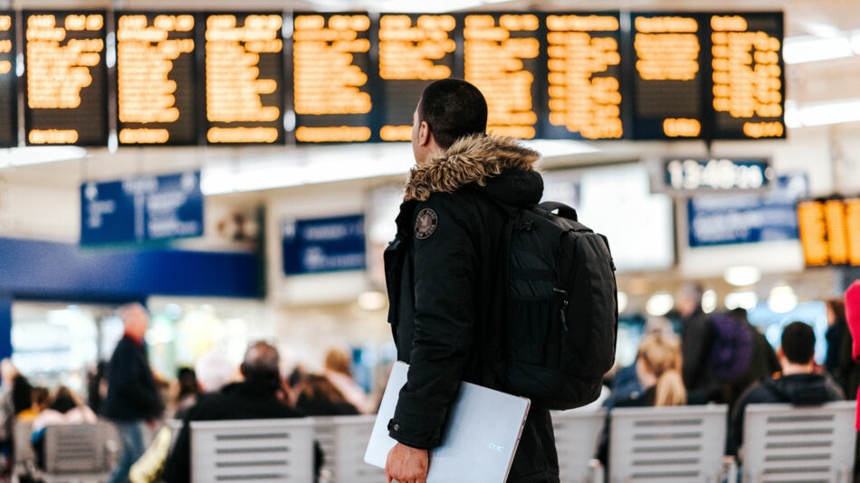 Man in airport with laptop