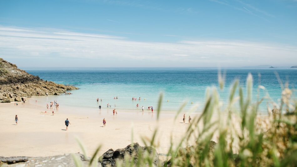 A group of people on a sandy beach.