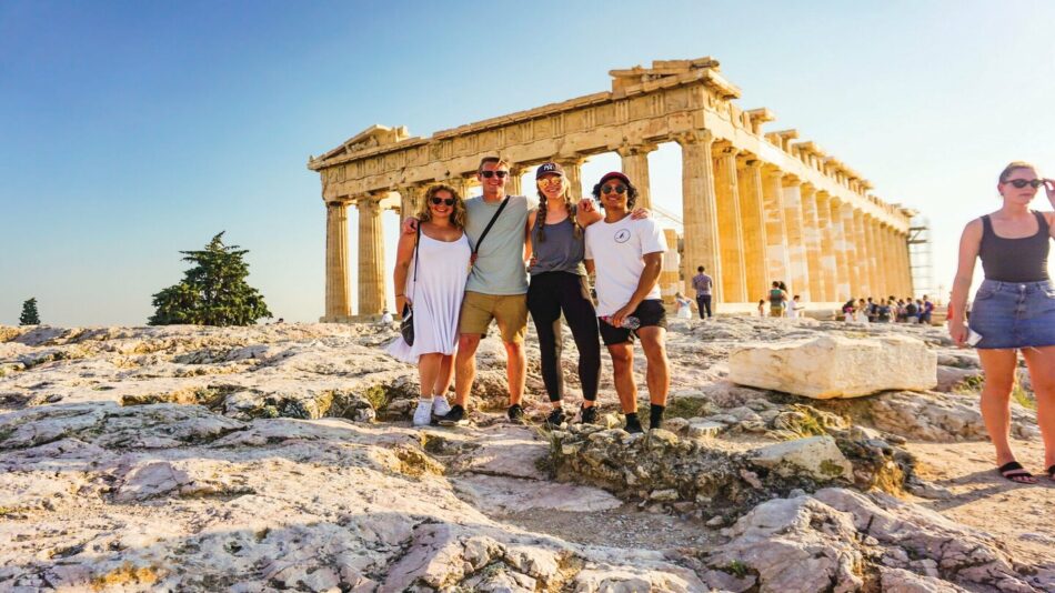 young group of travelers taking a picture in athens, greece