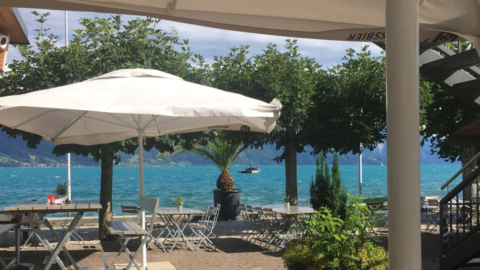 A white umbrella on a table in Austria.