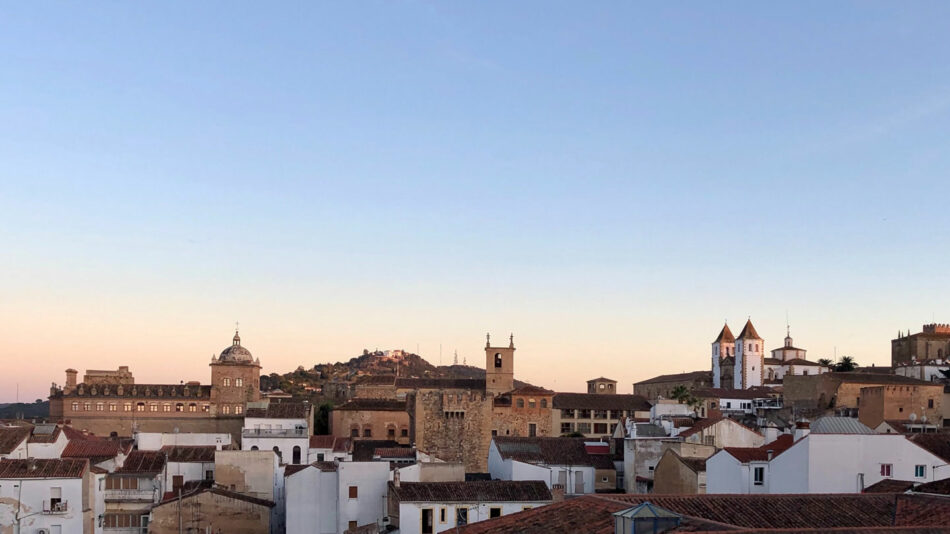 A view of a city at dusk with a castle, potentially serving as a filming location for House of the Dragon.