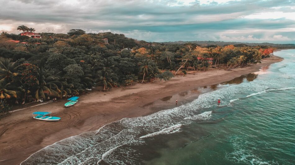 An aerial view of a beach in Costa Rica with boats.