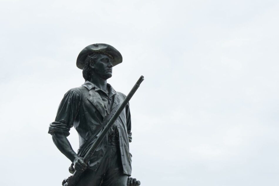 A statue of a man holding a rifle.