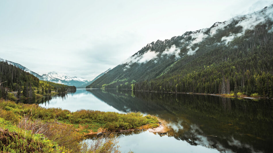 A picturesque lake nestled amid majestic mountains in Canada.