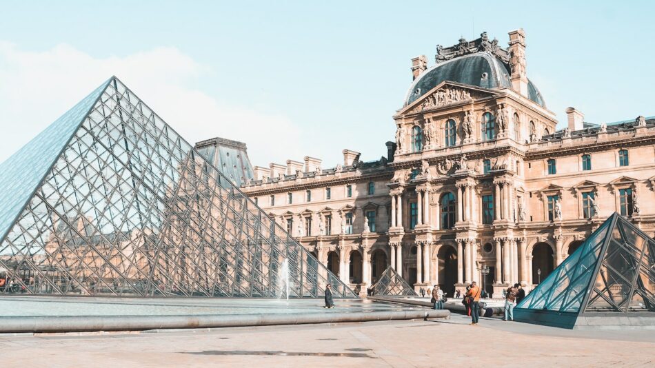 A trip to France to visit the Louvre with a pyramid in front.