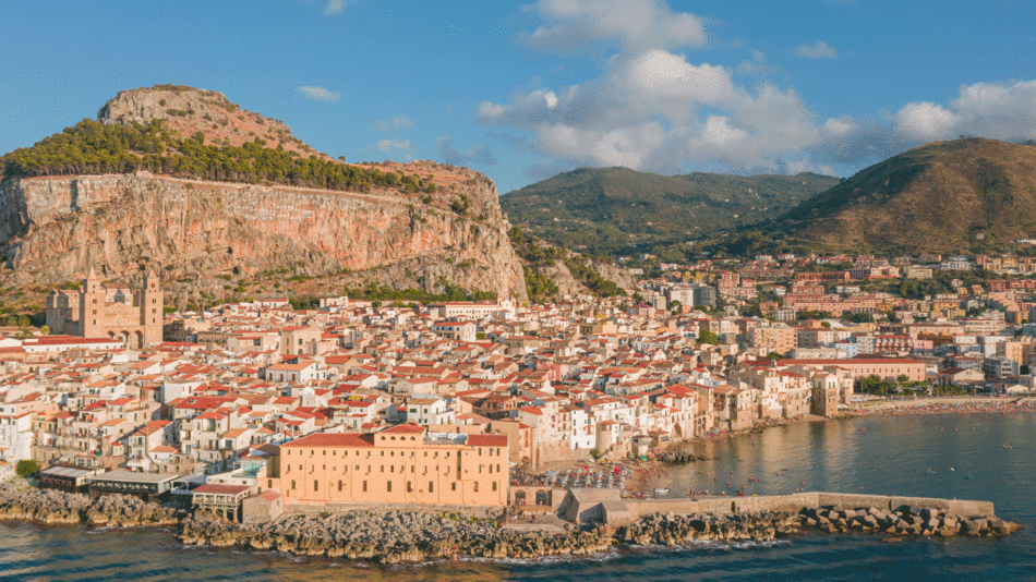 An aerial view of a coastal town in Italy, featuring captivating scenery and charming architecture.