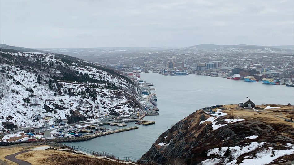 A view from the top of a mountain overlooking a city.