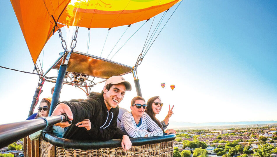 A group of people riding in a hot air balloon from LA to the bay.