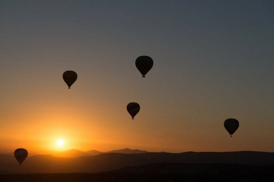 Hot air balloons at sunset in cappadocia.