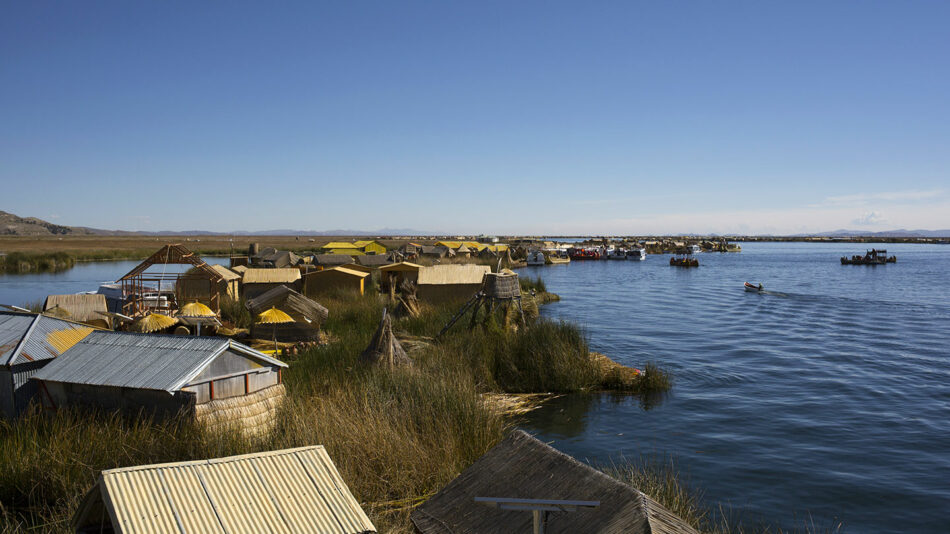 A group of huts on the shore of Lake Titicaca.