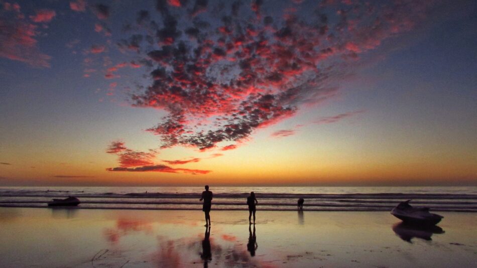 Two people enjoying the sunset at one of the best places to visit in Morocco.