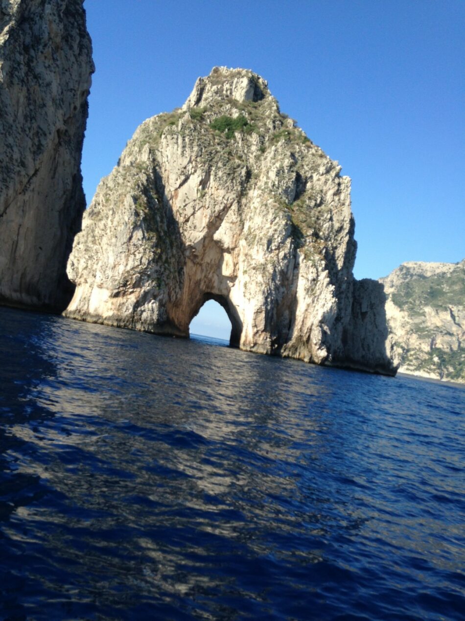 A mesmerizing rock formation in the crystal-clear waters of Italy.