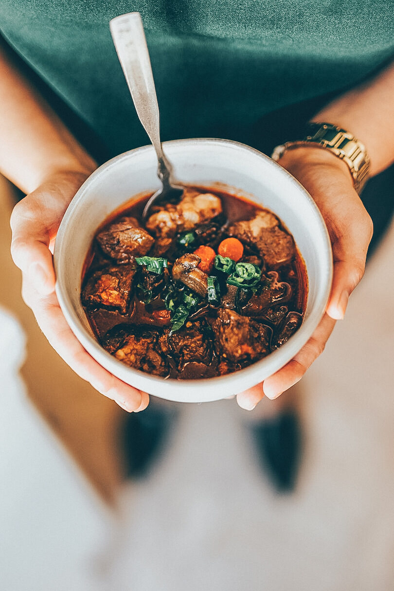 Holding a bowl of Irish stew