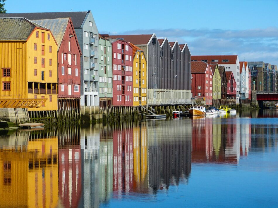 Colorful buildings along a river in the happiest country in the world.