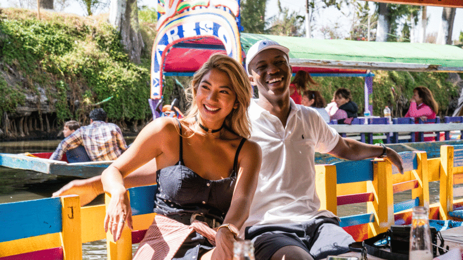 A couple enjoying a romantic boat ride in Mexico.