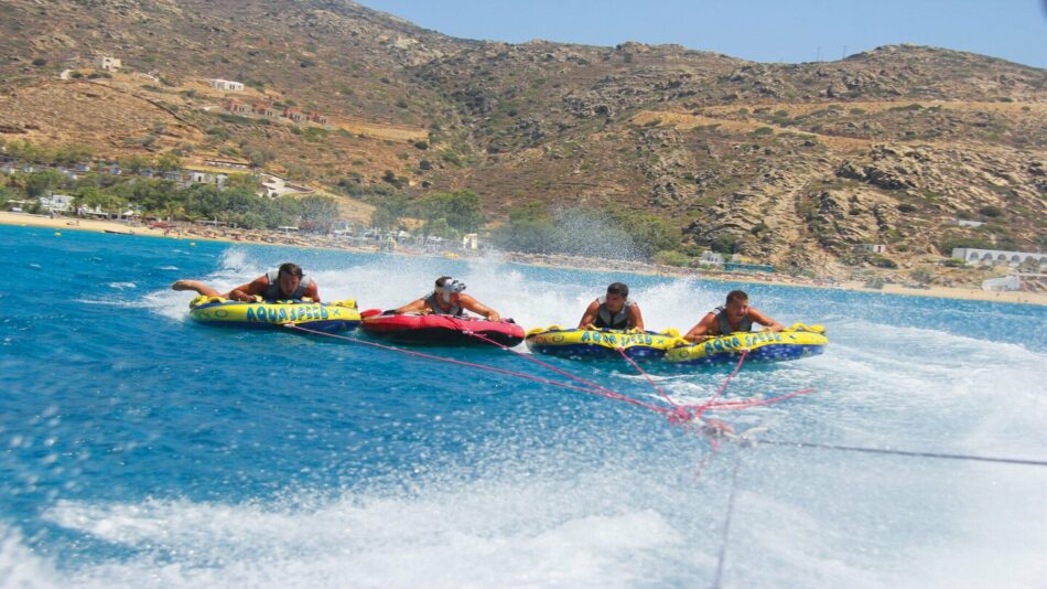 people practicing water tubing in mykonos