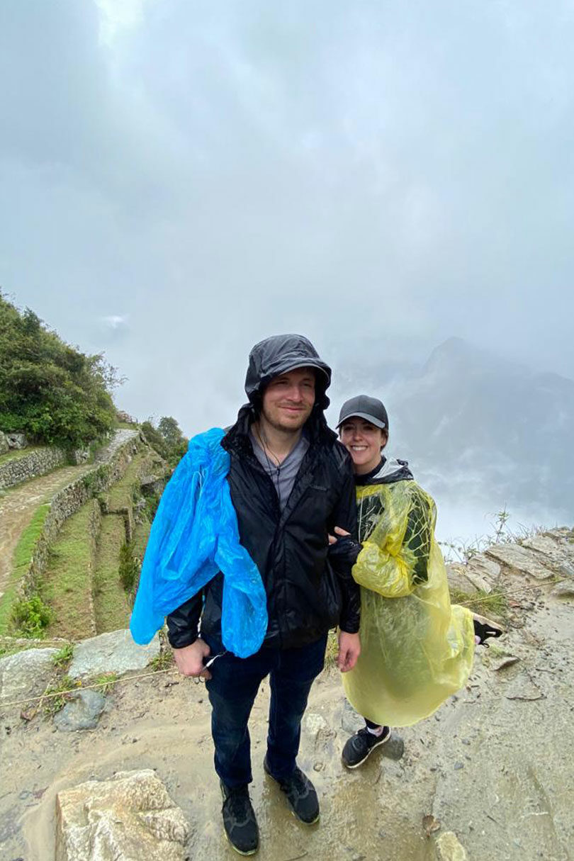 Couple in the rain at Machu Picchu on Contiki's Peru Panorama trip