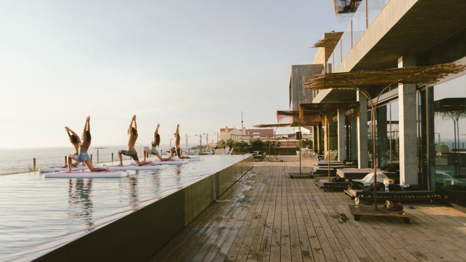 Yoga practitioners finding the best places to do yoga, including on top of a pool.