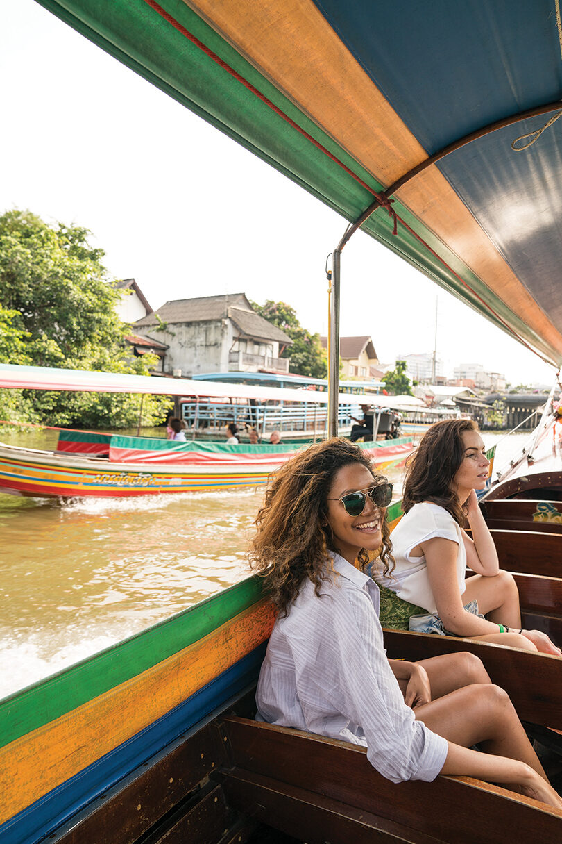 power-of-travel-girl-on-long-boat