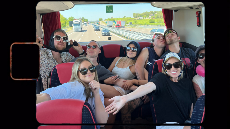 A group of people on a bus posing for a picture.