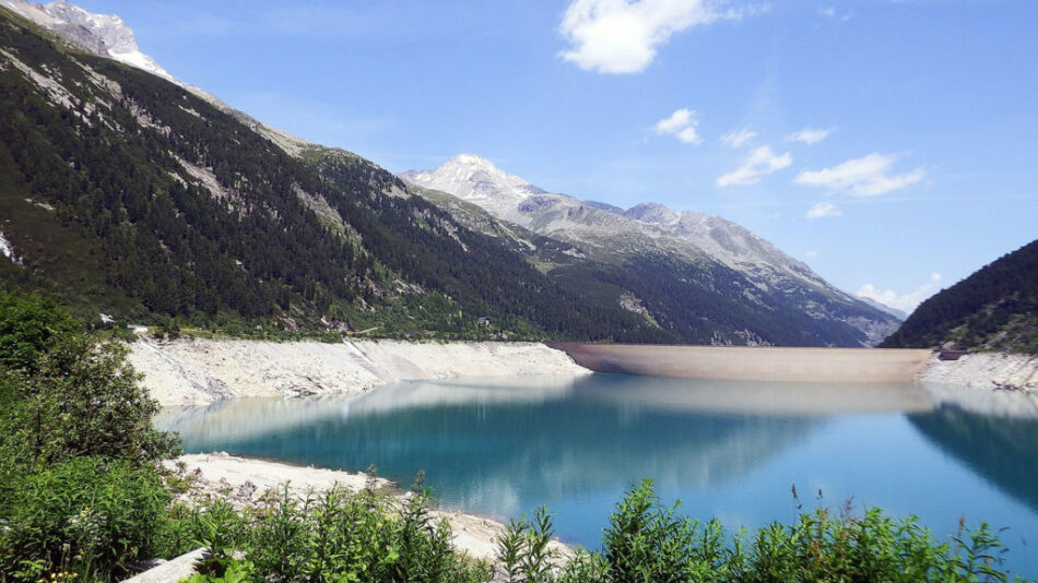 A tour manager overseeing a lake in the mountains.