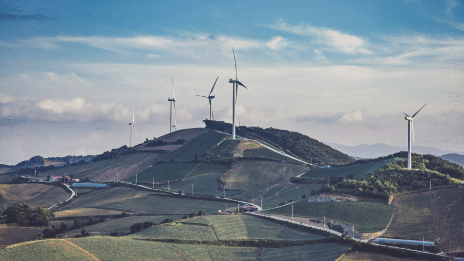 Positive environmental news: Wind turbines on top of a hill