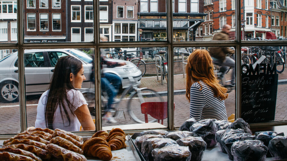 travel photography - girls outside cafe in amsterdam