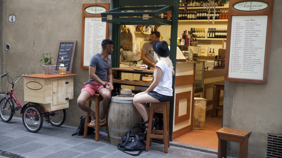 trip to europe - couple chatting to local in cafe