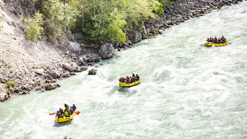 A group of people rafting down a river in Austria.