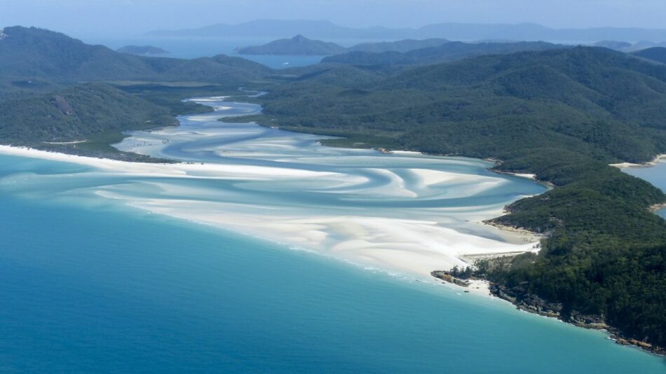 An aerial view of Whitehaven Beach in the Whitsundays, offering stunning photo ops in Australia.