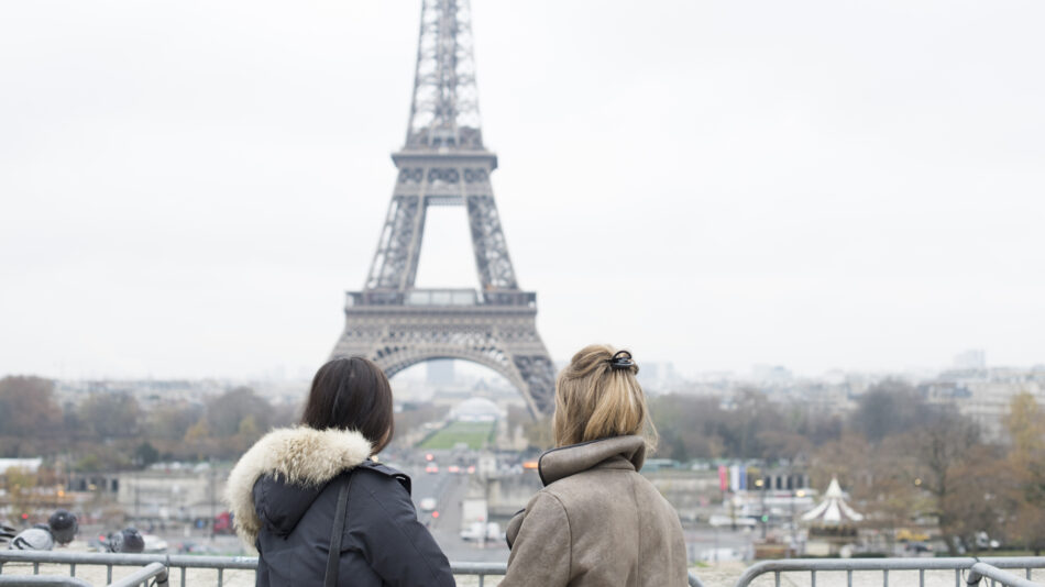 Image of two girls looking at the Eiffel Tower