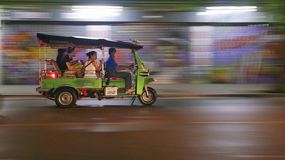 facts about Asia - tuk tuk driving through city