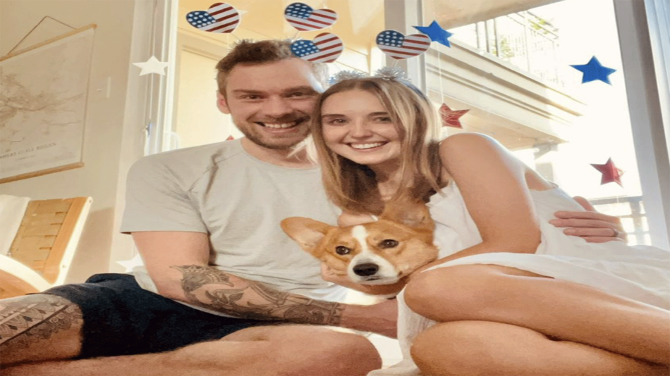 A real love story unfolds as a man and woman sit on a bed, accompanied by their beloved dog.