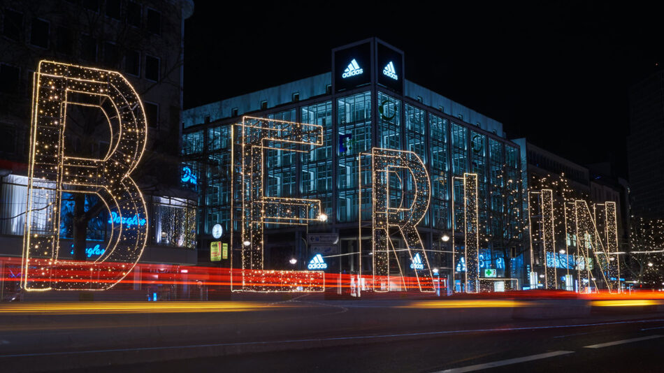 The word Berlin is lit up on the side of a building, showcasing the vibrant spirit of the city.