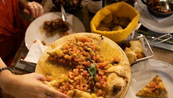 al fresco dining in Palermo, slice of pizza