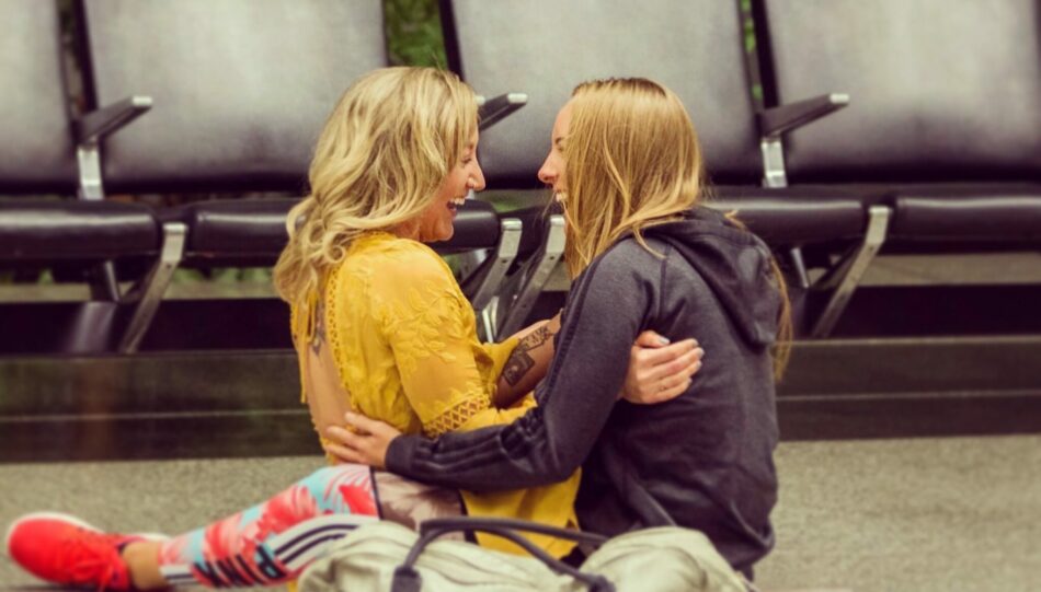 couple Charity and Peta after proposing in the airport