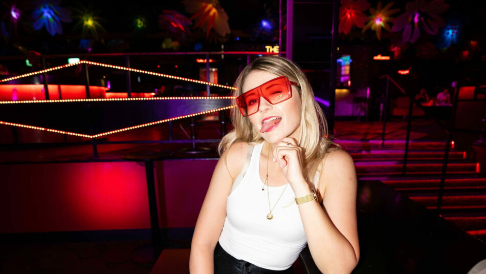 Rosie Turner posing in a club