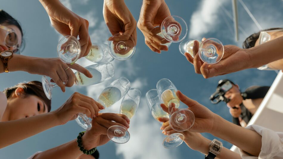 group of friends celebrating at sea