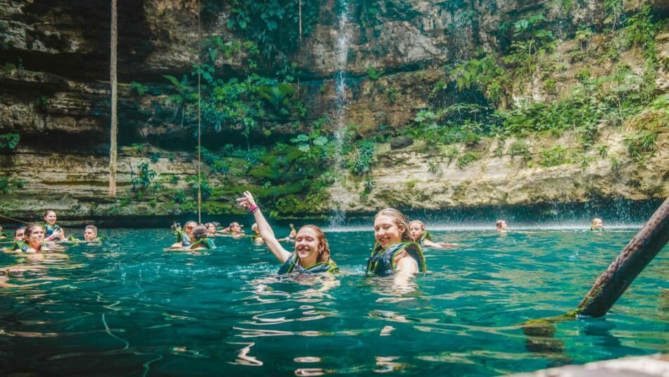 Contiki travellers swimming in a Cenote