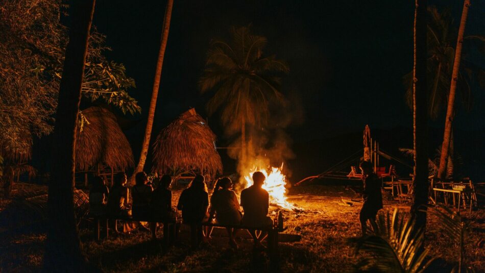 Travellers in the Philippines, bonfire by the beach