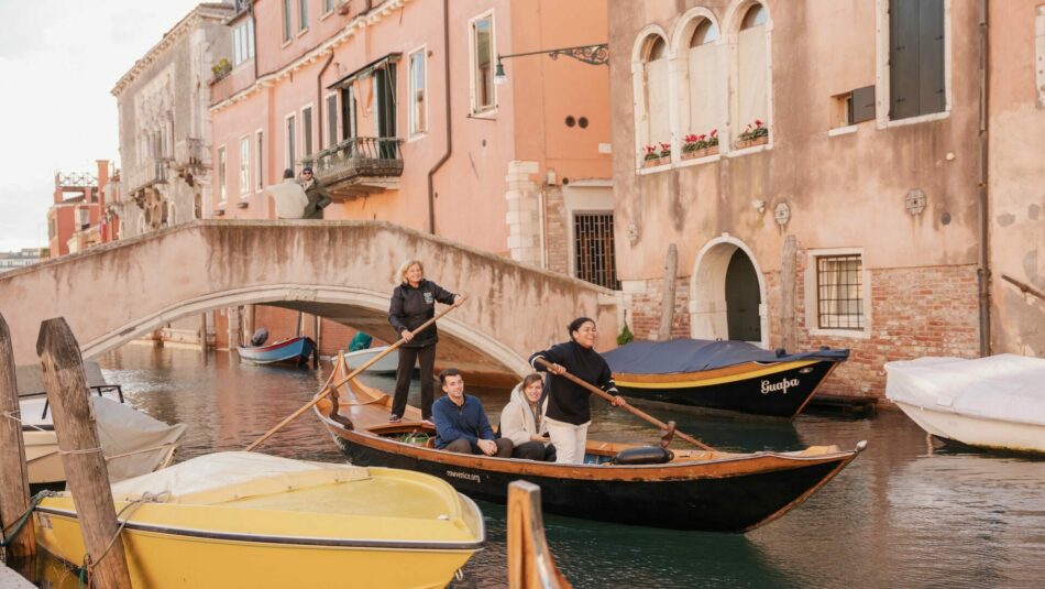 Row Venice, women gondoliering in Italy